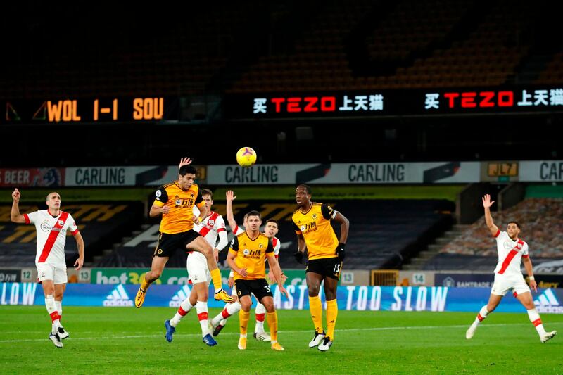 Wolves striker Raul Jimenez (2nd L) scores with this header but it is disallowed for offside. AFP