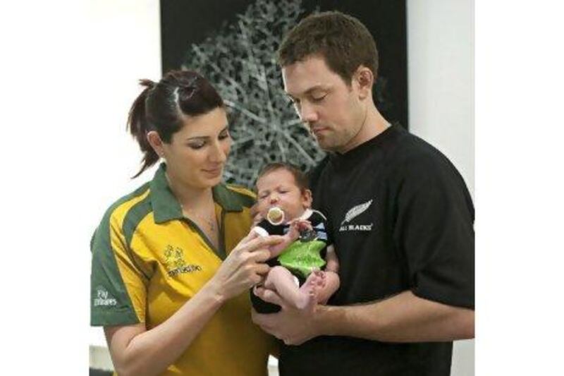 Divided loyalty: Patsy and Scott Keer with the three-month-old daughter Sienna in Dubai.