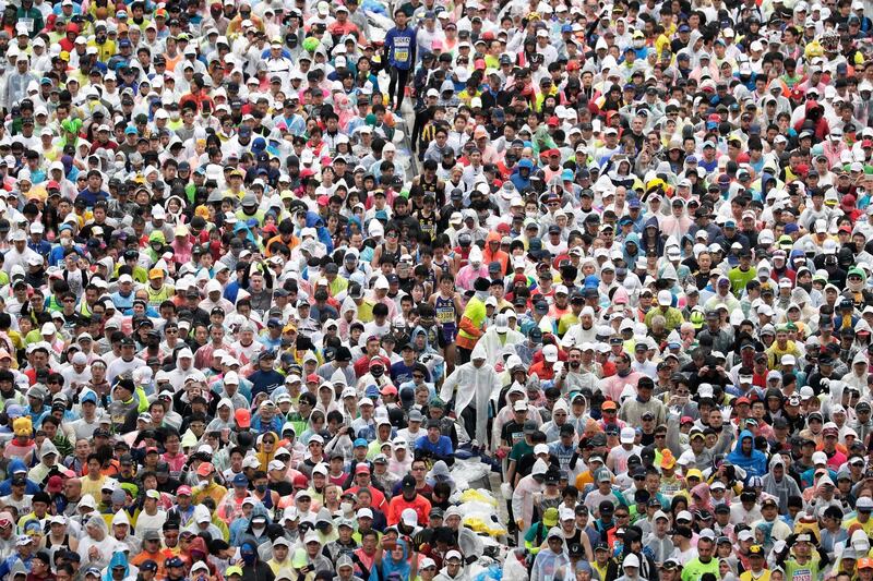 Runners fill the street in front of the Tokyo Metropolitan Government Building at the start of the Tokyo Marathon. EPA