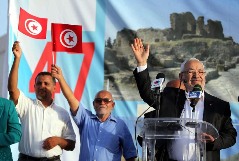 Tunisian Ennahda party leader Rachid Ghannouchi, right, is playing a long game to ensure Islamist parties keep a presence in the country's politics. Photo: Mohamed Messara / EPA