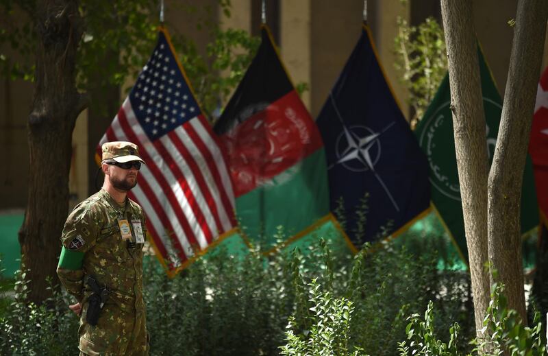 A member of the NATO military forces stands guard during a change of command ceremony at Resolute Support in Kabul. AFP