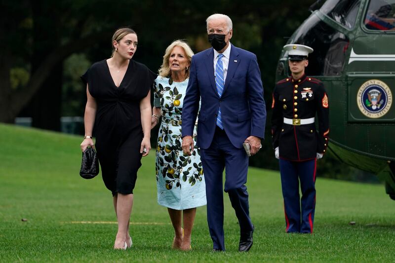 Joe, Jill and Naomi Biden walk across the South Lawn of the White House after returning on Marine One from a weekend in Wilmington, Delaware.  AP