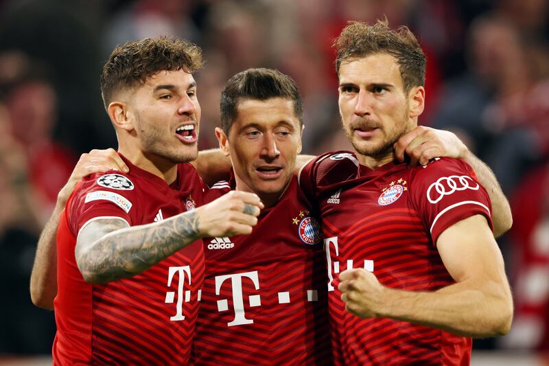 Bayern Munich's Robert Lewandowski celebrates with Lucas Hernandez and Leon Goretzka after putting his side ahead. Getty
