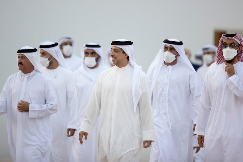 Sheikh Mansour bin Zayed, Deputy Prime Minister and Minister of Presidential Affairs; Sheikh Tahnoun bin Zayed, National Security Adviser (R); and Sheikh Sultan bin Hamdan bin Mohamed, Adviser to the President and chairman of the Camel Racing Federation (L), arrive for the group wedding.