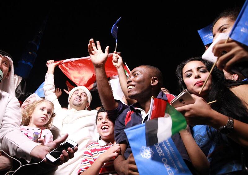 UAE residents celebrate Dubai’s success in winning the right to host what will be the first world fair in the Middle East. Ali Haider / EPA