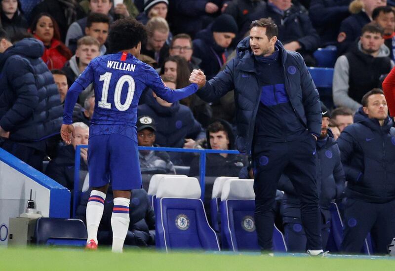 Willian with manager Frank Lampard after being substituted during the FA Cup match against Liverpool. Reuters