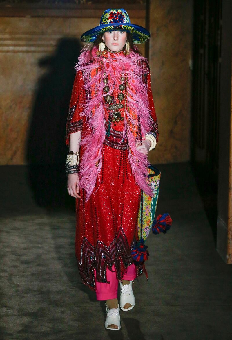 <p>The Gucci show opened with this shimmering beaded dress, trimmed with ostrich feather.</p>
