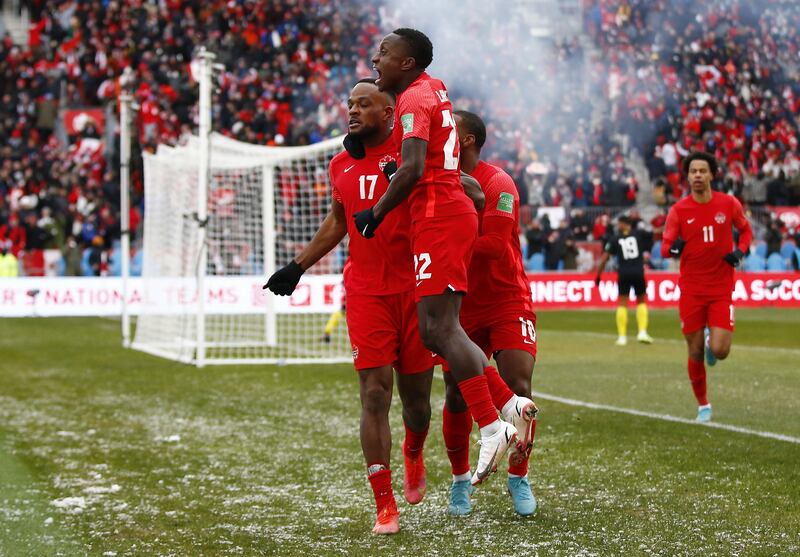 Cyle Larin celebrates with Richie Laryea and Junior Hoilett after scoring Canada's opening goal against Jamiaca in the 2022 World Cup Qualifying match at BMO Field on March 27, 2022 in Toronto, Ontario, Canada. Getty