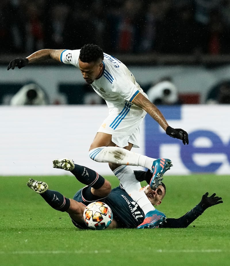 Real's Eder Militao duels with PSG's Marco Verratti. AP 