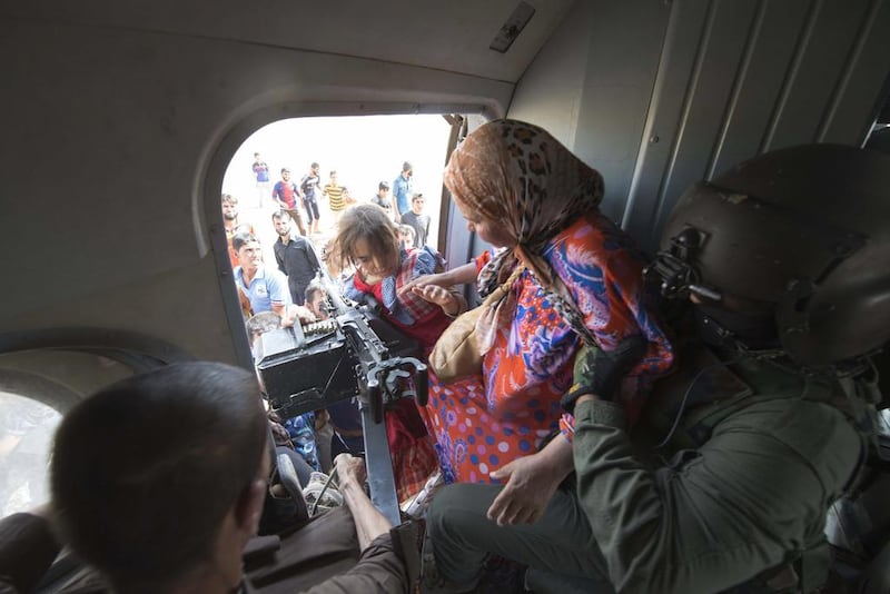 Women and children being evacuated from a Turkmen region of Iraq in 2014. Reuters