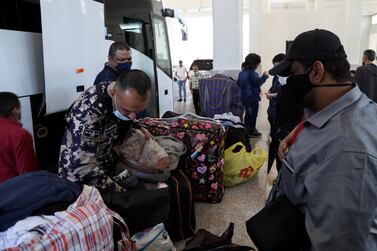 A customs officer inspects travellers'  belongings at Jaber border crossing with Syria, near Mafraq, Jordan, September 29, 2021.  REUTERS / Alaa Al Sukhni