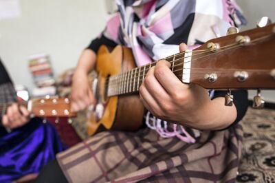 May 12, 2017 - Kabul, Kabul, Afghanistan: Two girls practice chord progressions on guitars. The children study with Lanny Cordola in Kabul.

Cordola’s work has grown increasingly challenging as the security situation in Kabul has worsened.



(Ivan Flores/The National)
