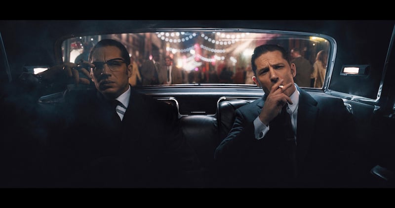 A handout movie still showing (L to R) Ronnie and Reggie Kray (TOM HARDY) in "Legend". From Academy Award® winner Brian Helgeland (L.A. Confidential, Mystic River) and Working Title comes the true story of the rise and fall of London's most notorious gangsters, both portrayed by Hardy in a powerhouse double performance. ​(Courtesy: Universal Pictures) *** Local Caption ***  8M60_TPT2_00004R.JPG