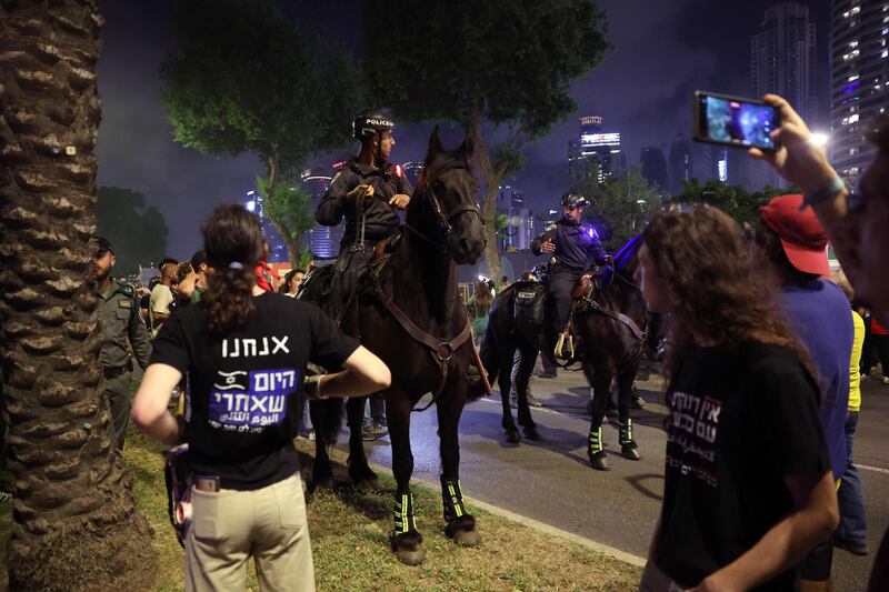 Israeli mounted police stand guard during the protest. AFP
