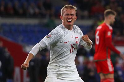 Poland striker Karol Swiderski celebrates after scoring against Wales. AFP