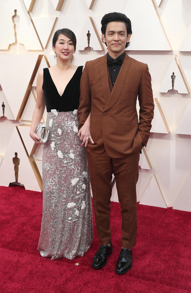 John Cho and Kerri Higuchi arrive at the Oscars on Sunday, February 9, 2020, at the Dolby Theatre in Los Angeles. EPA