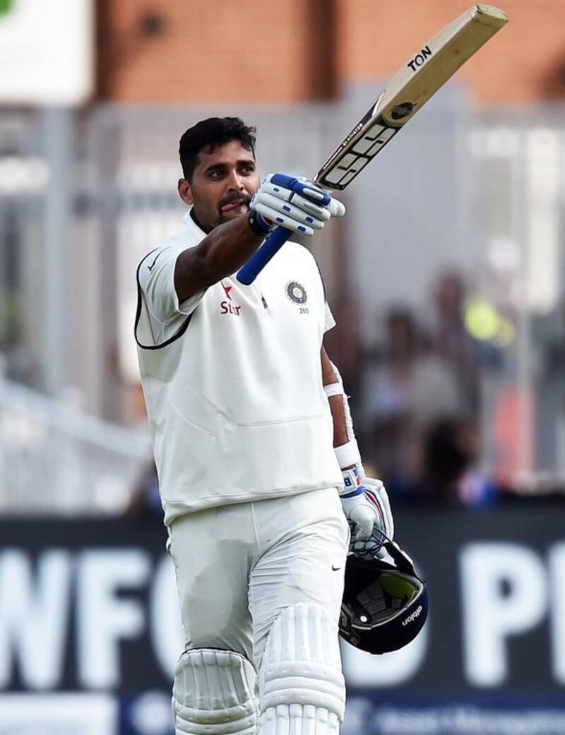India's Murali Vijay celebrates after reaching his century in Nottingham,. Paul Ellis / AFP