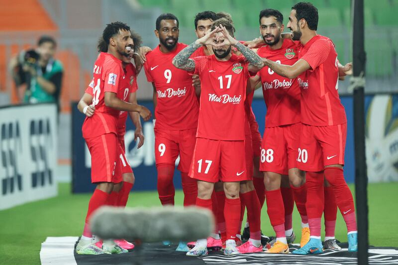 Federico Cartabia celebrates with teammates after scoring Shabab Al Ahli's fifth goal against Al Gharafa. AFP