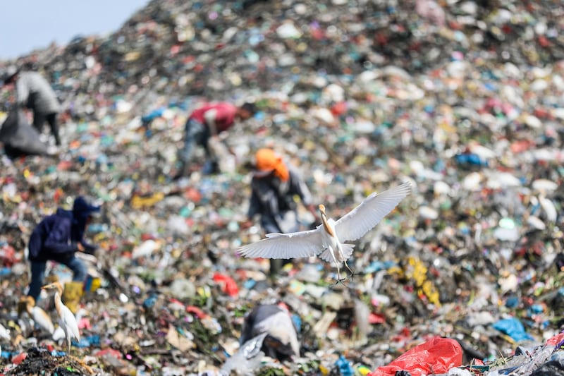 Scavengers collect plastic materials at a landfill site in Marelan, in north Sumatra, Indonesia. EPA