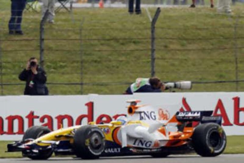 Fernando Alonso was quickest on a track drying out.