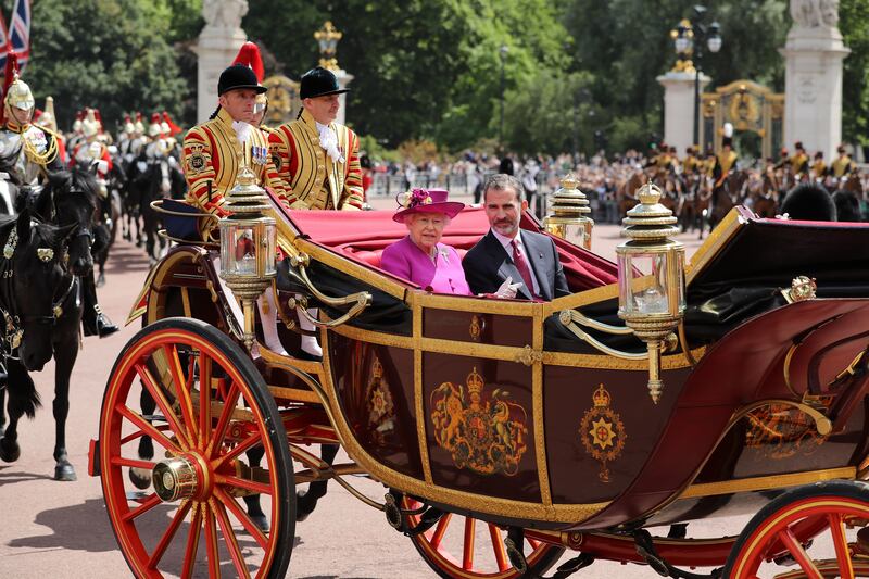 Queen Elizabeth and King Felipe VI of Spain ride in a carriage during a state visit by the king and queen of Spain, at Buckingham Palace in July 2017. Getty Images