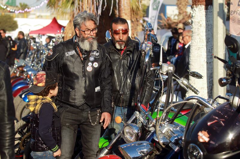 Libyan bikers admire motorcycles in Benghazi.