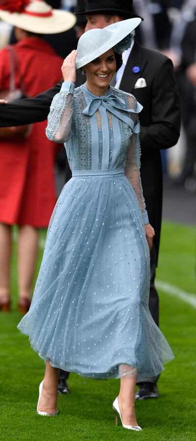 epa07655837 Britain's Catherine, Duchess of Cambridge arrives in the parade ring at Royal Ascot, in Ascot, Britain 18 June 2019. Royal Ascot is Britain's most valuable horse race meeting and social event running from 18 to 22 June 2019.  EPA-EFE/NEIL HALL