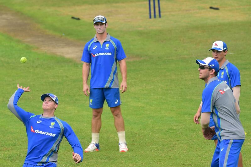 Australia cricket captain Steven Smith (L) plays ball with teammates during a training session at the Sher-e-Bangla National Cricket Stadium in Dhaka on August 21, 2017.
Australia has cancelled the only warm-up match of their two-Test tour of Bangladesh due to poor conditions at the ground, officials said on August 21. The two-day match at Fatullah, slated to start on August 22, had been in doubt since heavy rain partially flooded part of the field. / AFP PHOTO / MUNIR UZ ZAMAN