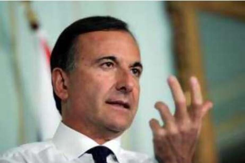 Italian Foreign Minister Franco Frattini talks to the media during a joint press conference with British Foreign Secretary David Miliband, unseen, in London, Wednesday, July 30, 2008. (AP Photo/Sang Tan, Pool)