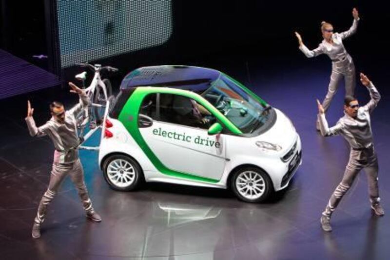 Dancers perfom during the presentation of the new e-smart by German car maker Daimler AG at the international car show IAA (Internationale Automobil-Ausstellung) in Frankfurt/M., western Germany, on September 13, 2011. The world's biggest motor show, the IAA, is running from September 15 to 25, 2011. AFP PHOTO DANIEL ROLAND
 *** Local Caption ***  819263-01-08.jpg