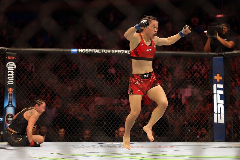 Weili Zhang celebrates after defeating Carla Esparza to win their Women Strawweight fight at UFC 281. Getty