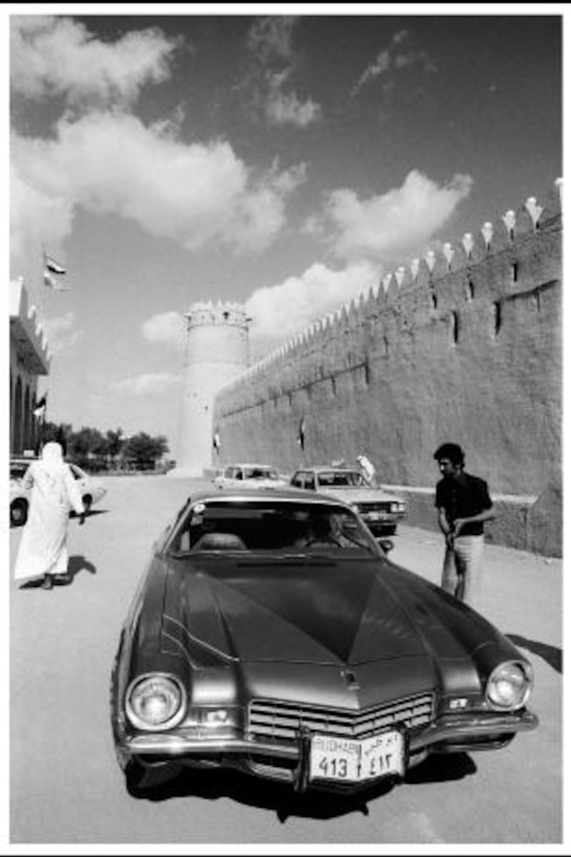 Abu Dhabi 1974. A car and man outside the walls of Qasr Al Hosn Fort.

Photograph by Jack Burlot