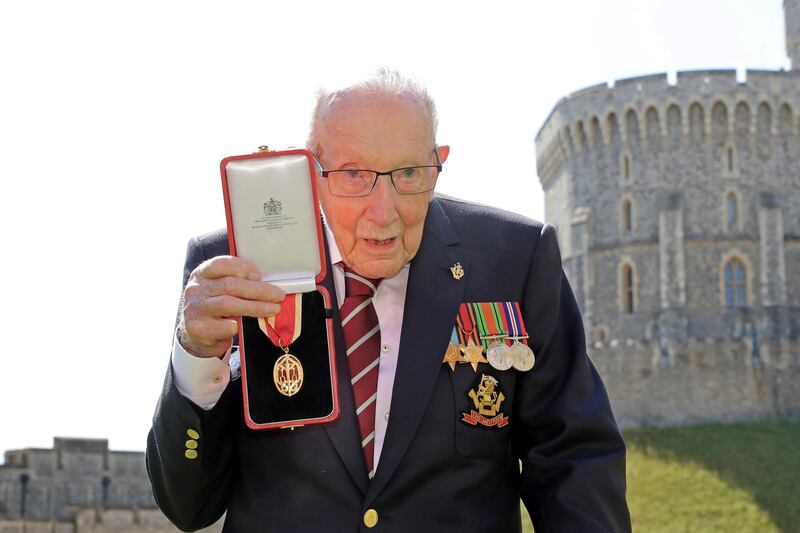 Captain Tom Moore poses after being awarded the insignia of Knight Bachelor by Queen Elizabeth II. Reuters