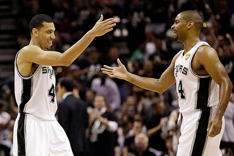 San Antonio Spurs' Danny Green, left, reacts with Gary Neal after scoring during the first half at Game 3 of the NBA Finals basketball series against the Miami Heat, Tuesday, June 11, 2013, in San Antonio. (AP Photo/Eric Gay) 
