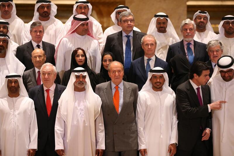 King Juan Carlos of Spain, centre (in grey suit), poses for a group photo with UAE and Spanish participants of the UAE-Spain Economic Forum.  Ali Haider / EPA