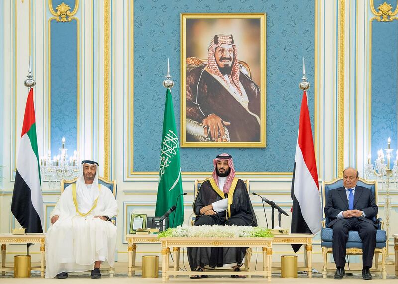 Sheikh Mohamed bin Zayed, Prince Mohammed bin Salman and Mr Hadi at the agreement-signing ceremony. AFP
