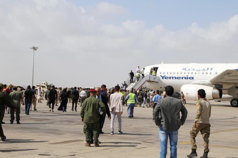 People wait to greet members a newly formed cabinet for government-held parts of Yemen upon their arrival at Aden airport, before an attack on the airport, in Aden, Yemen. REUTERS