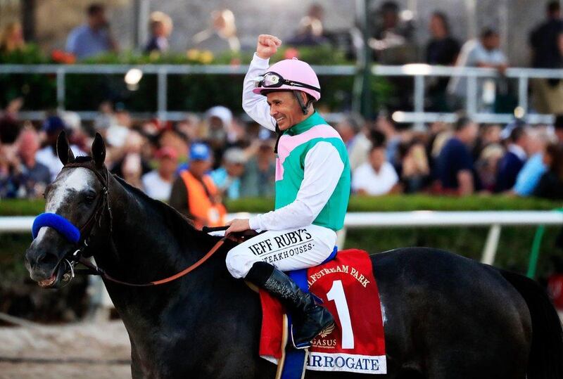 Jockey Mike Smith celebrates atop Arrogate after winning the $12 Million Pegasus World Cup Invitational at Gulfstream Park on January 28, 2017 in Hallandale, Florida. Cliff Hawkins / Getty Images