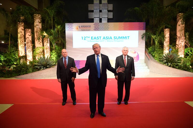 US President Donald Trump gestures to the press as US National Security Advisor HR McMaster, left, and US Secretary of State Rex Tillerson look on after attending the 31st ASEAN Summit in Manila. Jim Watson / AFP Photo