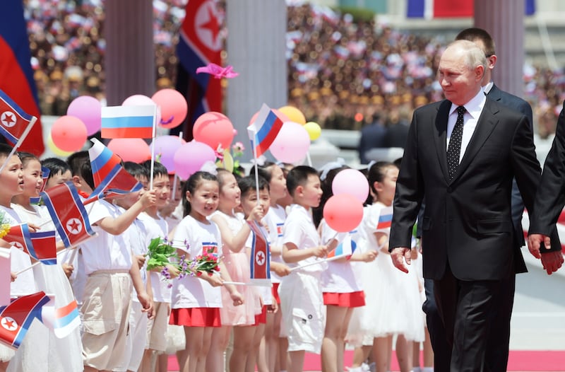 Children greet Mr Putin at the ceremony. EPA / Sputnik
