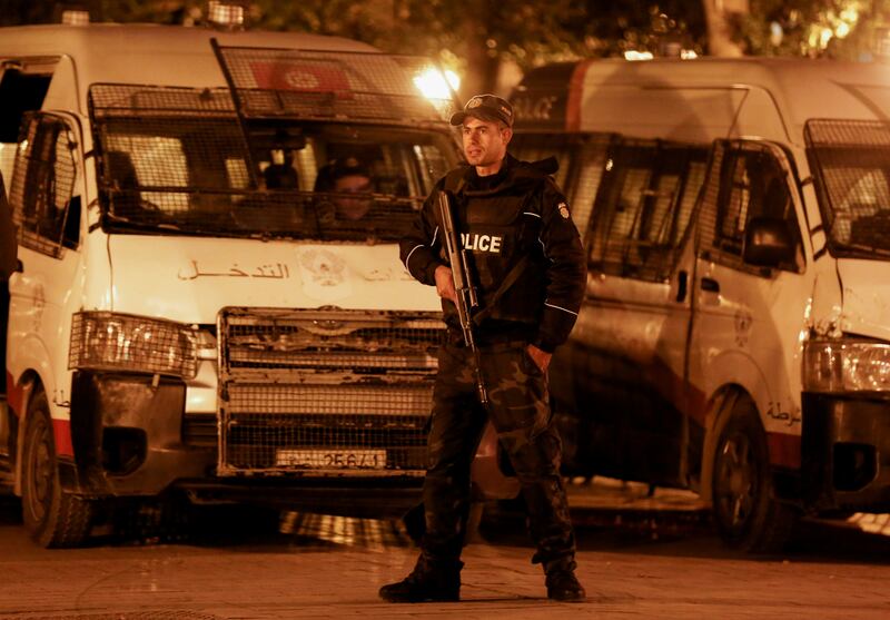 A Tunisian police officer stands guard near the Interior Ministry in Tunis on November 26. Reuters