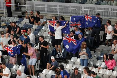 Fans of Australia's Nick Kyrgios cheer him on during his match against France's Ugo Humbert during their second round match at the Australian Open tennis championship in Melbourne, Australia, Wednesday, Feb. 10, 2021. (AP Photo/Hamish Blair)