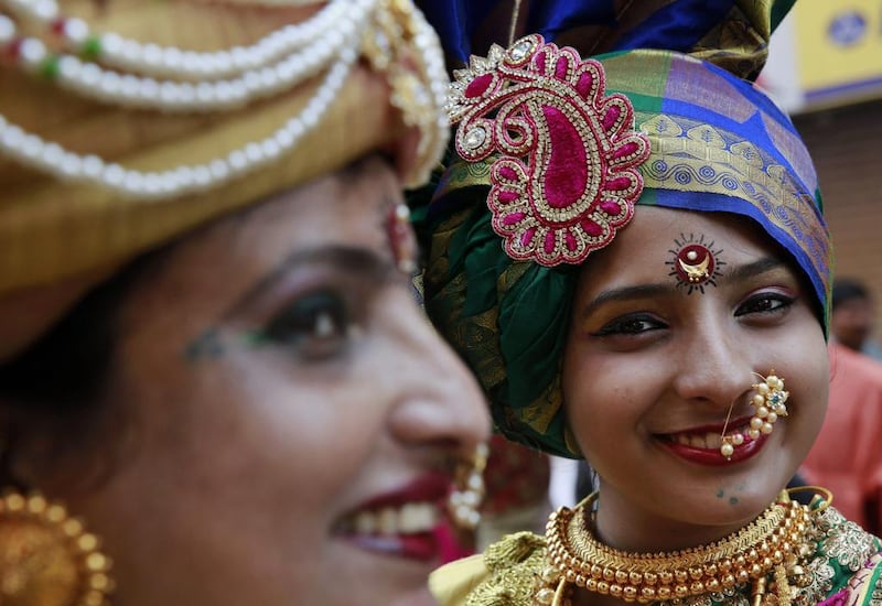 Indian women dressed in traditional attire during a procession to mark Gudi Padwa in Mumbai. AP