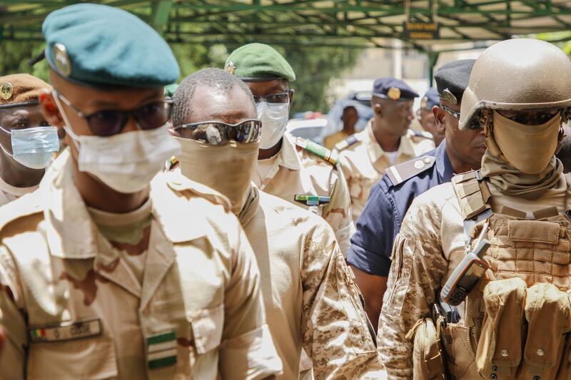 BAMAKO, MALI - AUGUST 24: President of the CNSP, the junta that ousted President Keita last week, surrounded by Malian special forces, arrives at the transitional talks with ECOWAS on August 24, 2020 in Bamako, Mali. Three-day talks in Mali between junta and West African leaders following last weeks coup aimed at resolving the country's political future have ended without agreement. (Photo by John Kalapo/Getty Images)