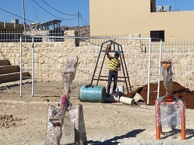 A member of the factory team installs the playground elements in Umm Sayhoun in September. Photo: Maleab