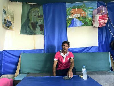 Riad Dawood, 45, a Syrian who has lived in Greece for two years and seven months, spends his mornings at Gold Cafe to escape the boredom of a caravan. September 14, 2018. Anna Zacharias / The National