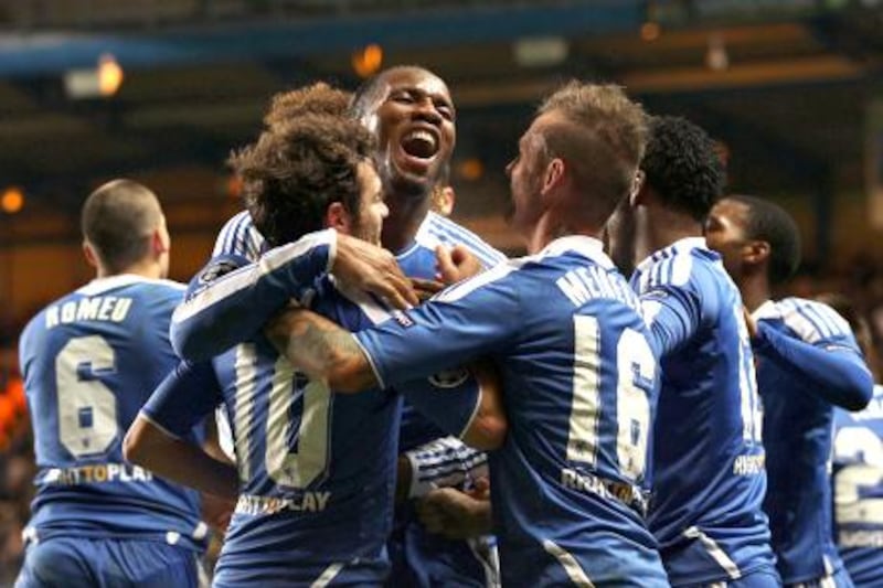 LONDON, ENGLAND - DECEMBER 06:  Didier Drogba of Chelsea (C) celebrates as he scores their third goal during the UEFA Champions League Group E match between Chelsea FC and Valencia CF at Stamford Bridge on December 6, 2011 in London, England.  (Photo by Scott Heavey/Getty Images)