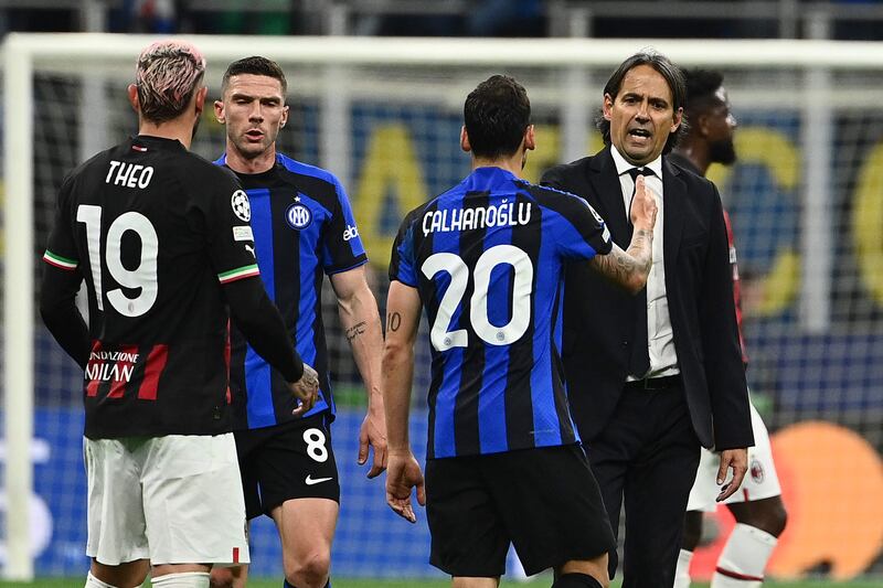 Simone Inzaghi congratulates Hakan Calhanoglu after Inter Milan's victory over AC Milan in the Champions League semi-finals. AFP