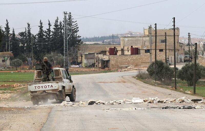 Opposition fighters backing Turkish troops in the village of Hazwan on the outskirts of the Syrian town of Al Bab on February 12, 2017 as they advance towards the town which is the last stronghold of ISIL  in Aleppo province, Syria. Rafat Ahmad / AFP 