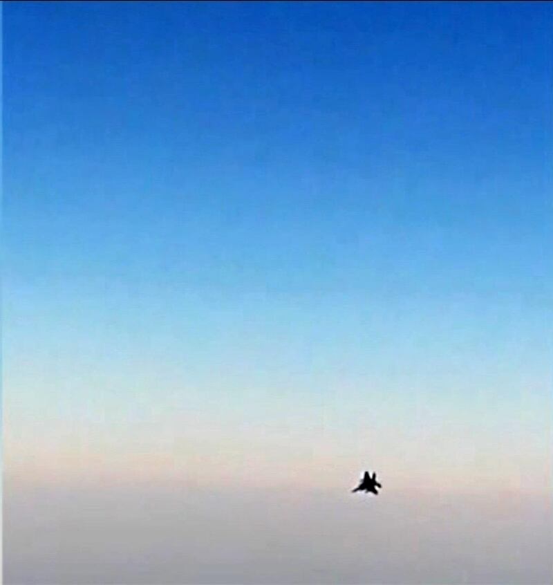 An image grab from a video released by state-run Iran Press news agency reportedly shows a fighter jet seen from the Mahan Air plane after it was intercepted by a US F-15 while flying over Syria.  AFP